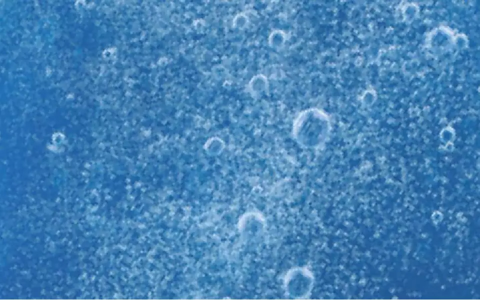 A blue background filled with bubbles of varying sizes, creating a textured and dynamic appearance.