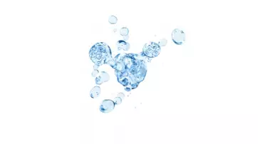 Bubbles rising in a blue liquid, creating a dynamic underwater scene.