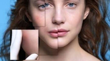 A close-up of a woman's face divided into geometric sections, with a smaller inset showing a hand lightly touching her cheek. The background is a soft blue.