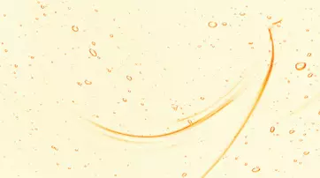 An abstract image featuring a light yellow background with small bubbles and curved lines in a slightly deeper orange hue.