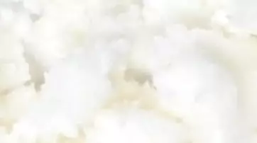 A close-up of fluffy, white mashed potatoes with a creamy texture.