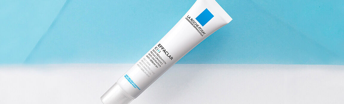 A tube of La Roche-Posay Effaclar skincare product against a blue and white background.