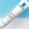 A tube of La Roche-Posay Effaclar skincare product against a blue and white background.