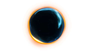 A circular image depicting a dark central area surrounded by a glowing orange and blue halo, resembling a solar eclipse or a cosmic phenomenon.