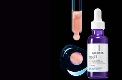 Flacon de serum de soins de la peau avec pipette, sur fond noir.