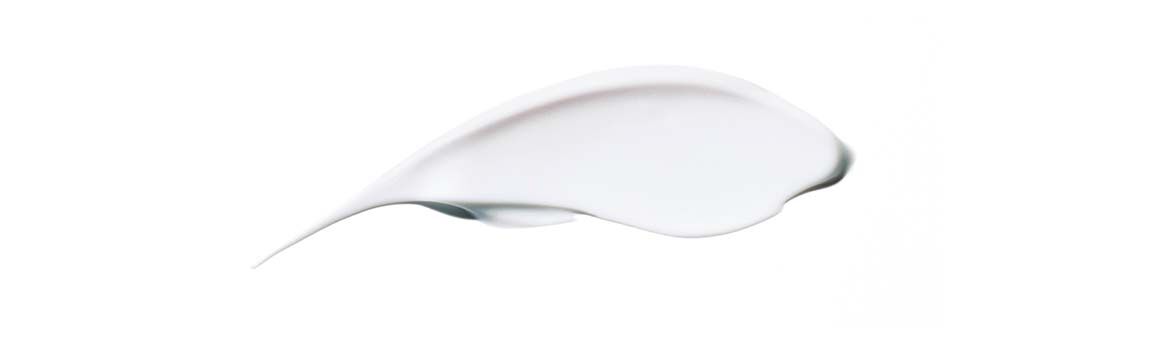 A smooth, curved streak of white cream or lotion on a plain background.