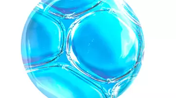 Close-up of translucent bubbles or spheres against a blue background, creating a fluid and reflective texture.